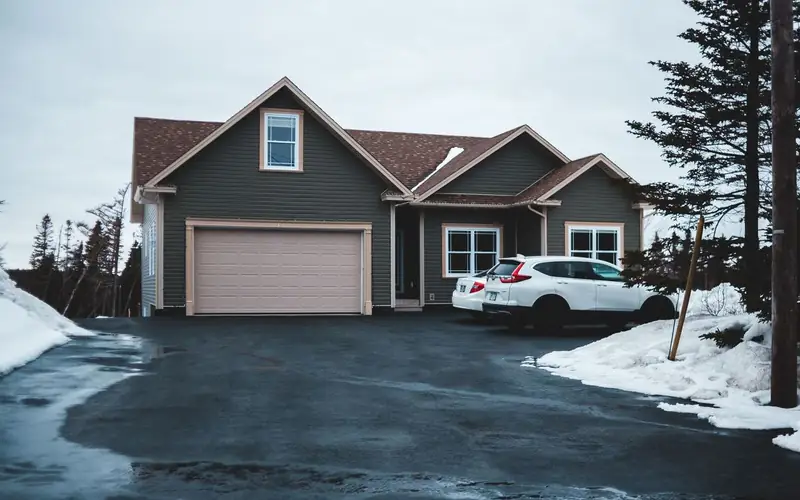 Dark driveway surfacing with a neat paved edge